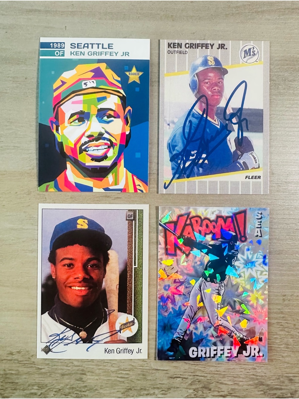 Ken Griffey Jr Signed Rookie Lot of (4) Kaboom Holo Fleer Novelty Cards.
